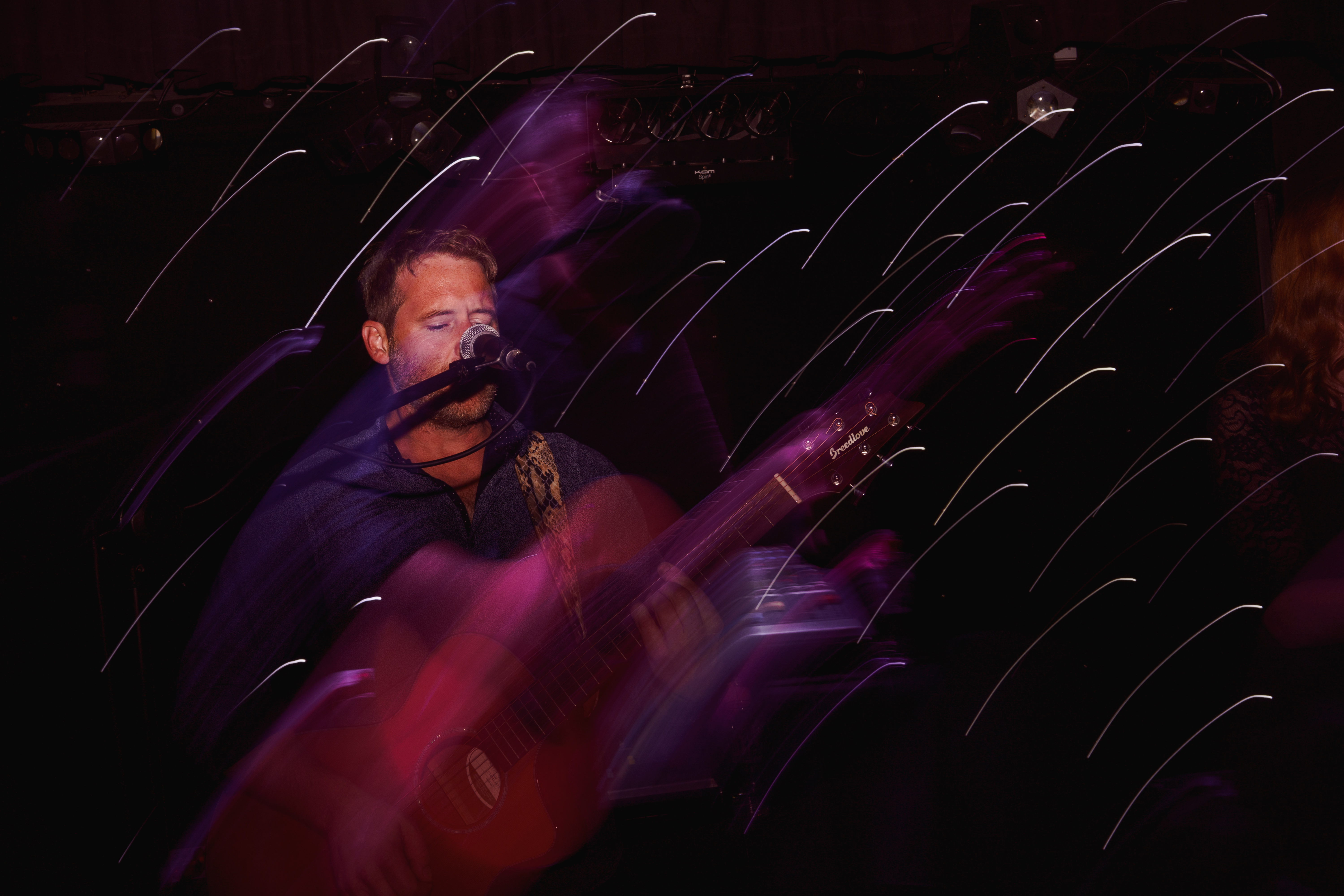 Kath + Trevor-108 Guitarist on stage playing